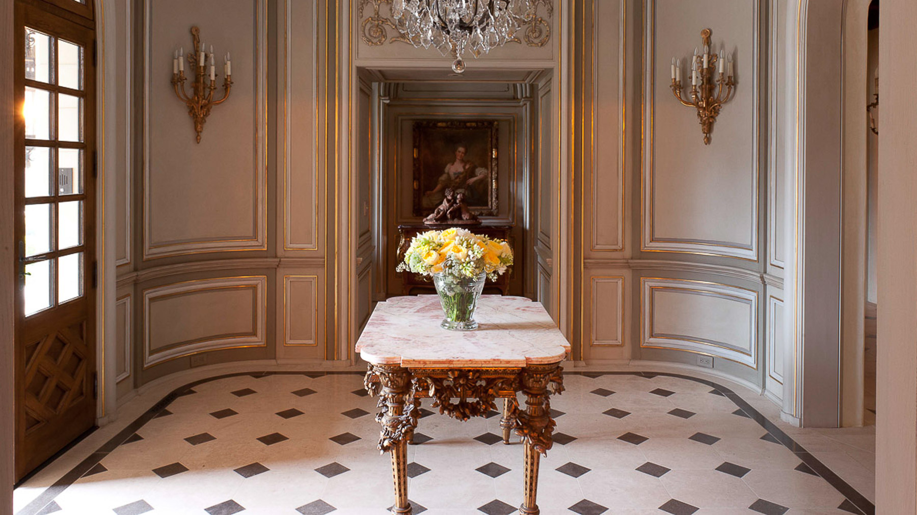 Gilded detailing for wood panels for foyer room with marble floors